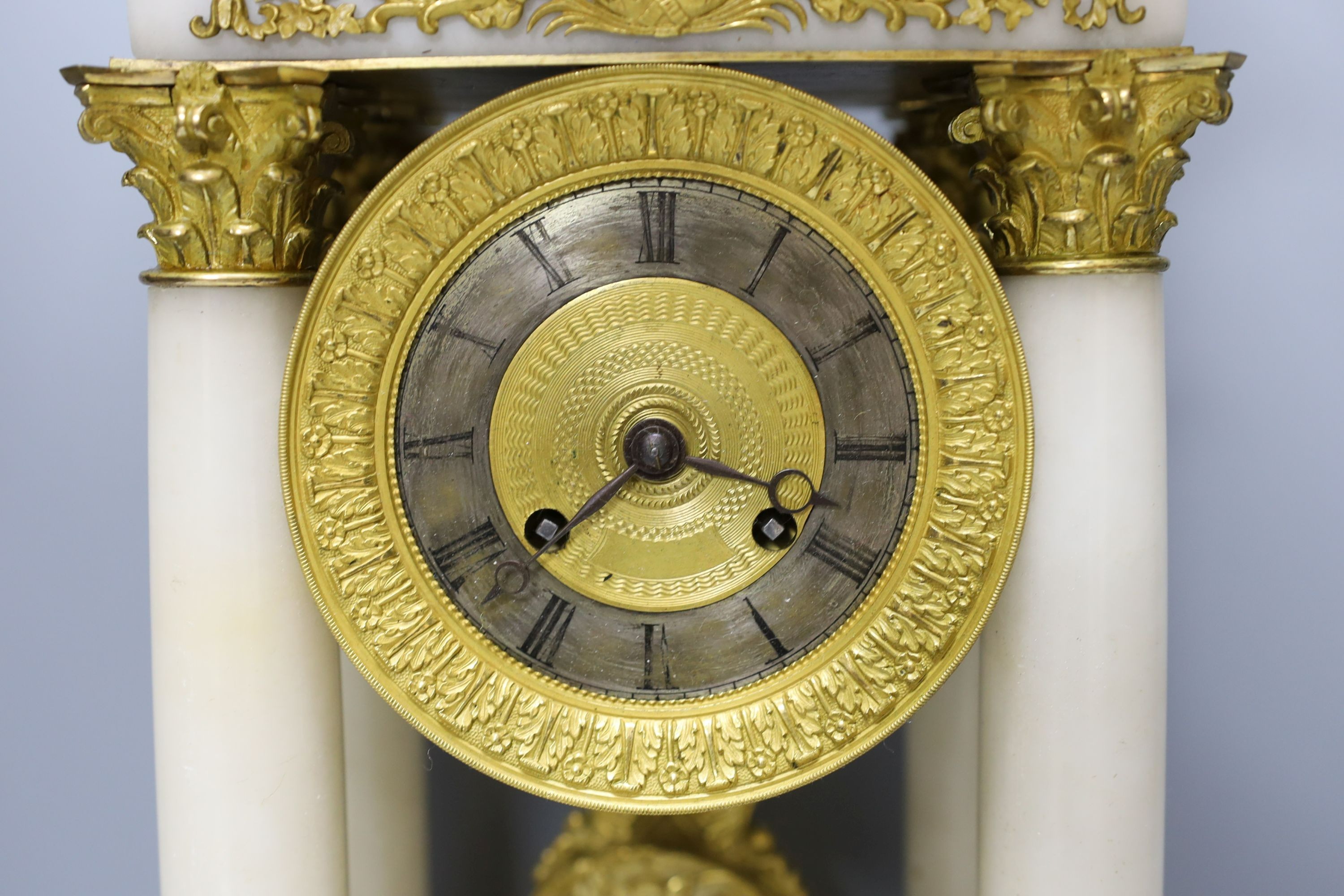 A 19th-century French ormolu and alabaster portico clock 53cm